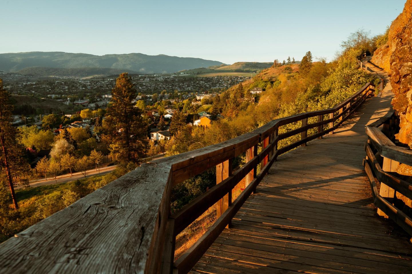 boardwalk portion of a trail with gorgeous view of city and mountains