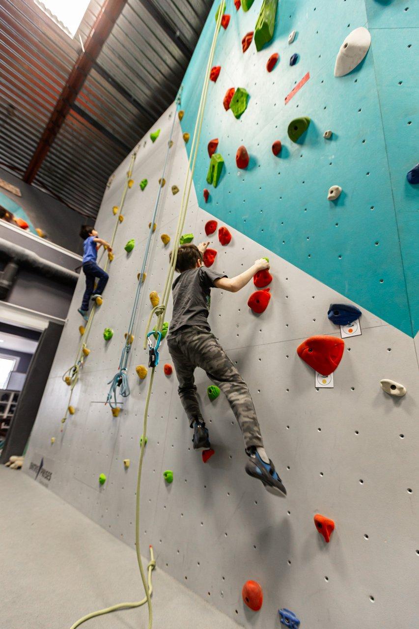 kid on indoor climbing wall