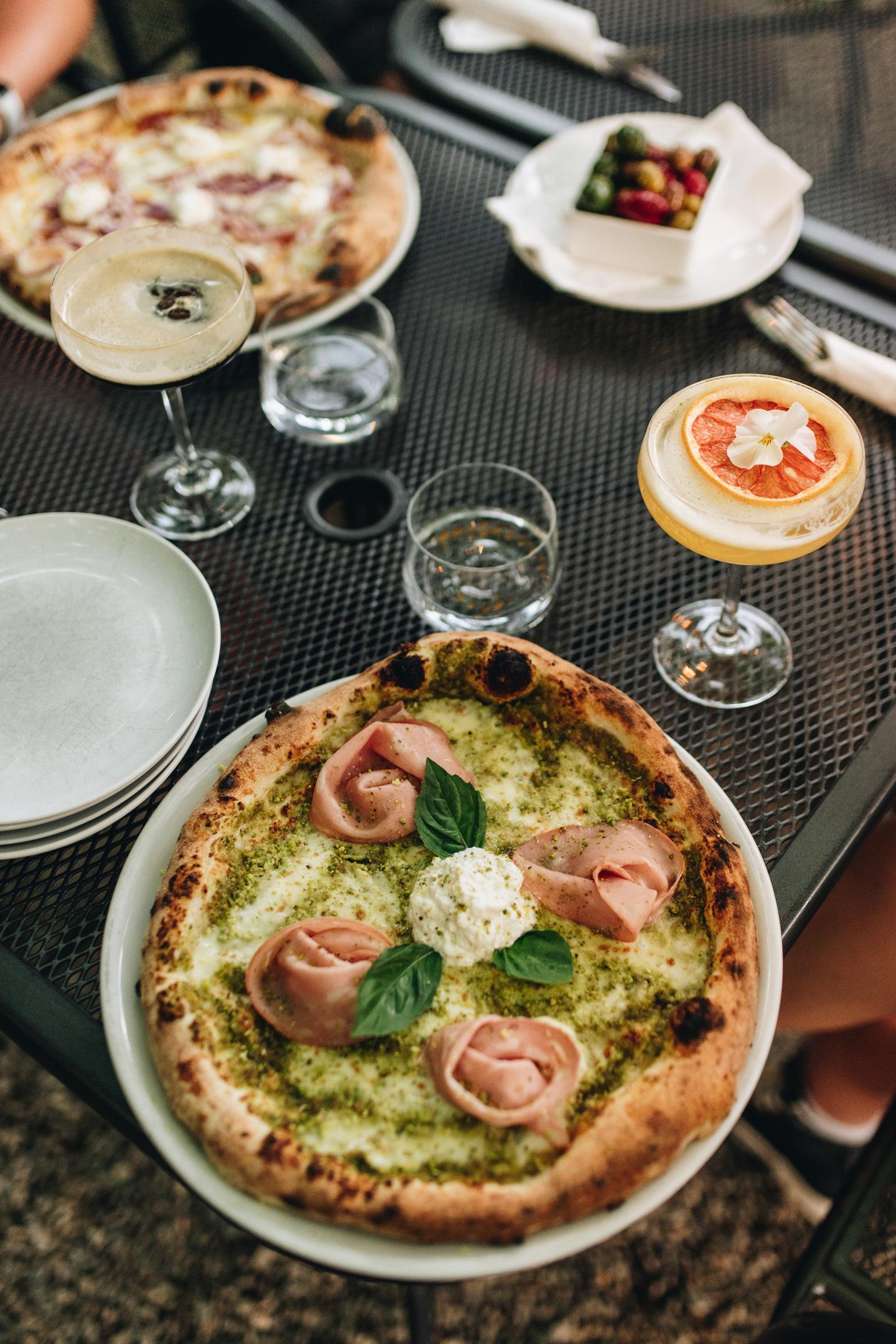 plated pizza with drinks