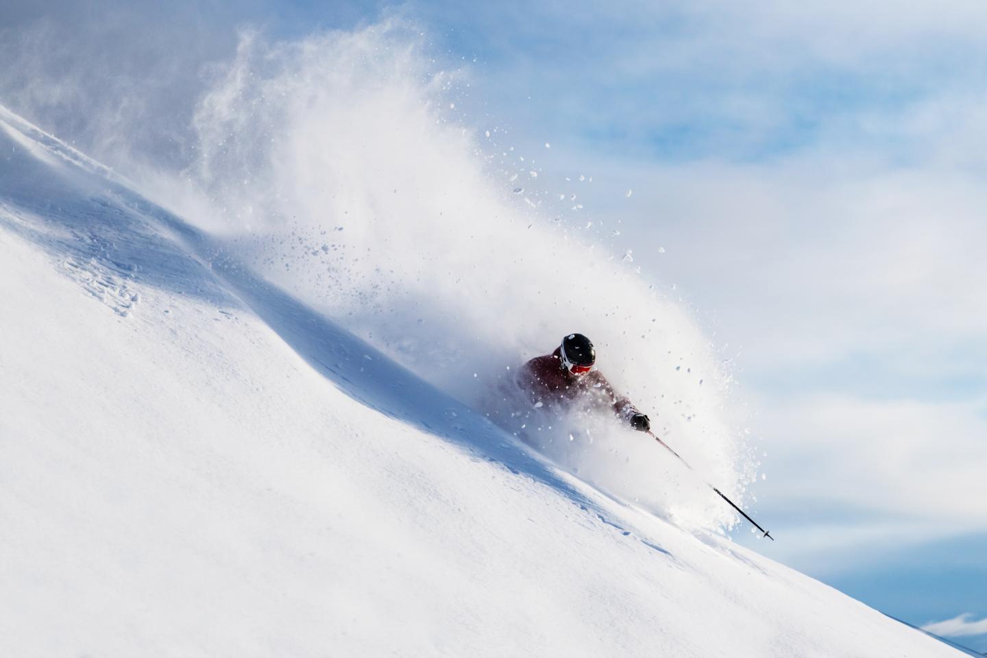 person skiing in deep powder