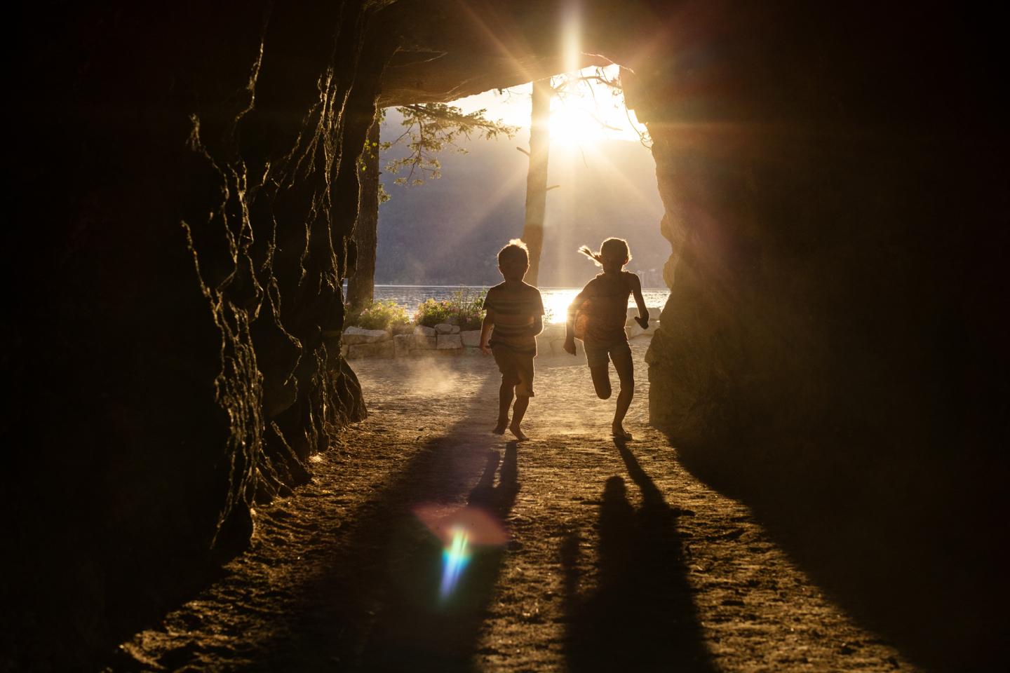 Kids running through tunnel