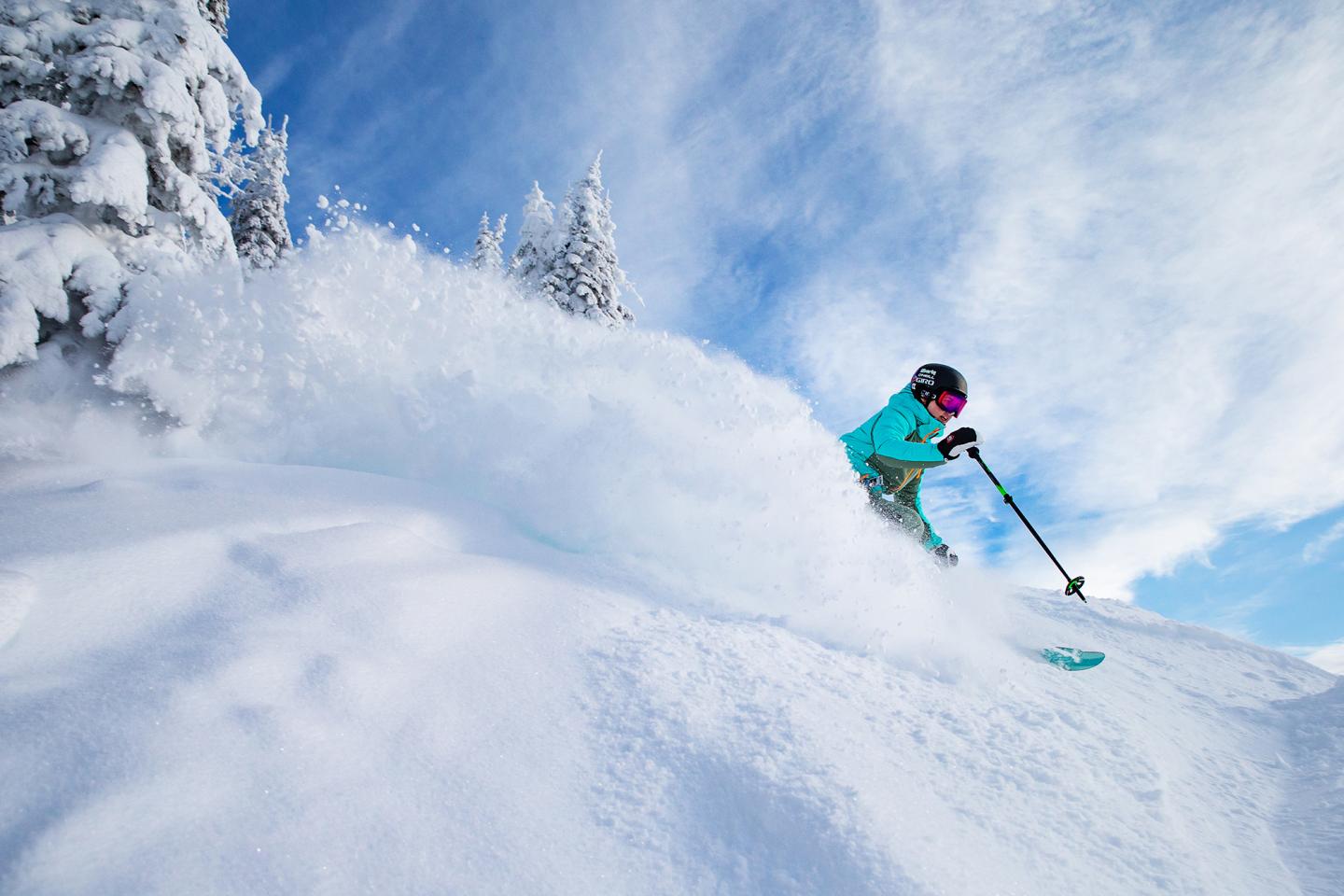 person skiing in powder