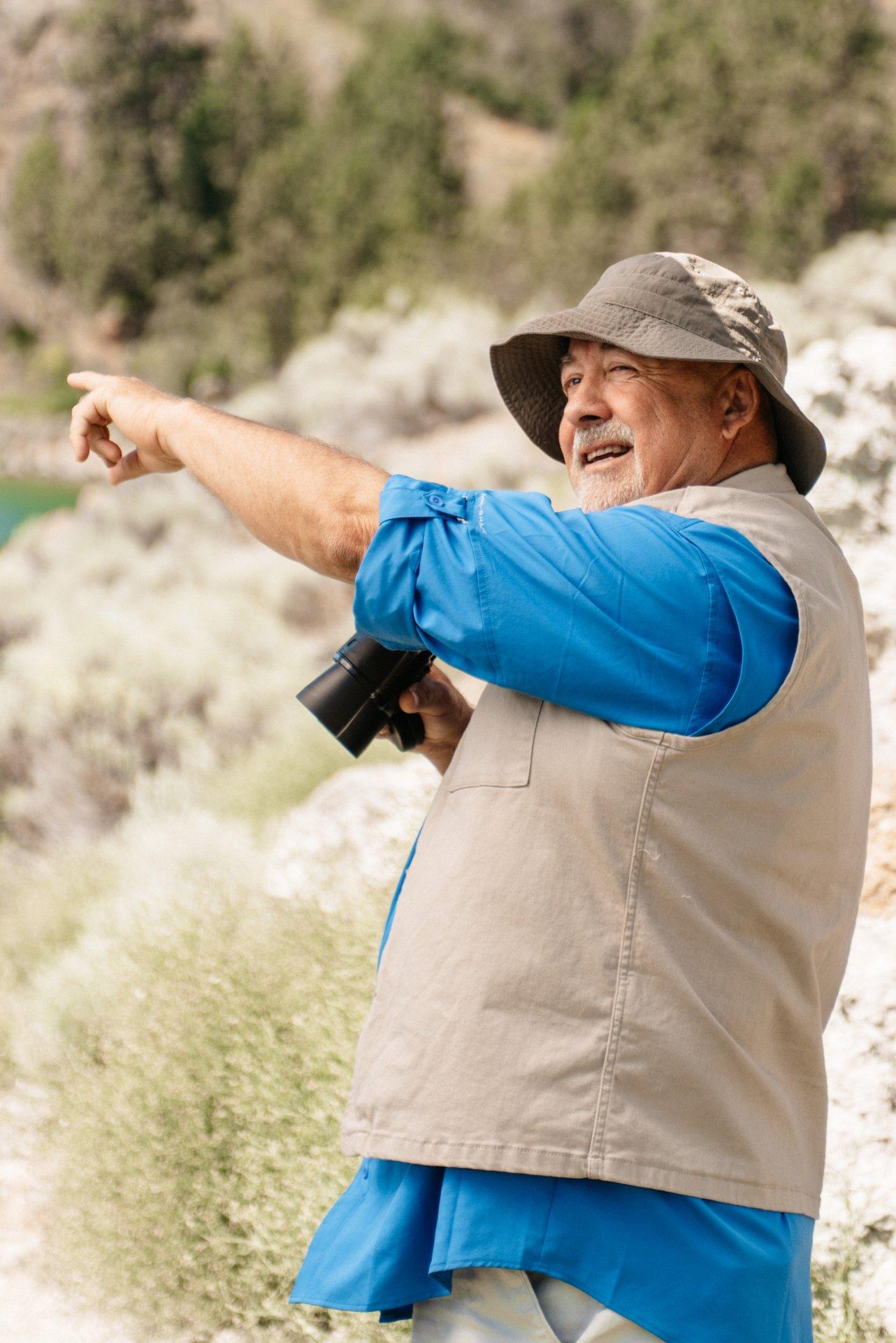 Man pointing out bird