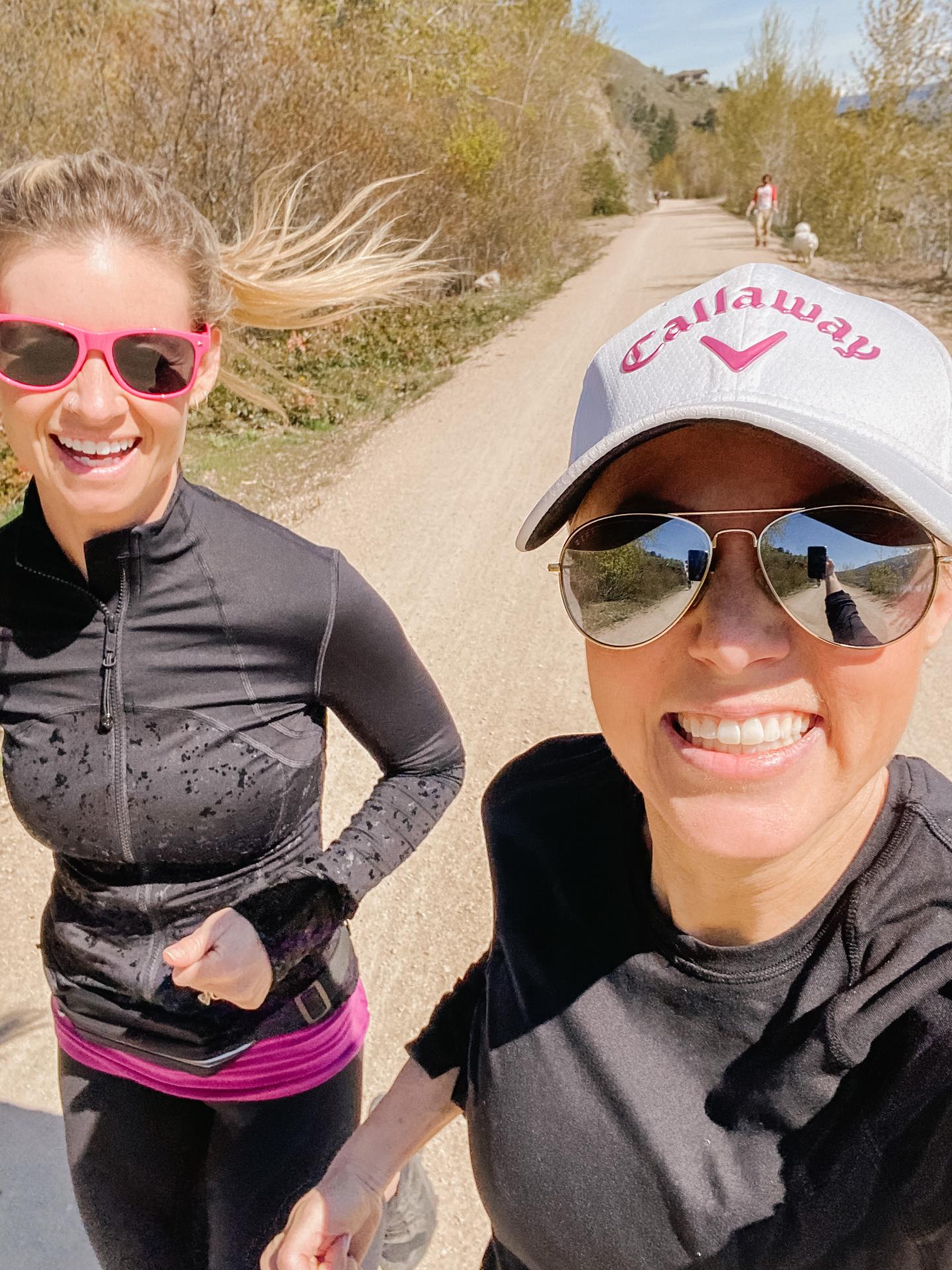 two women smiling during run