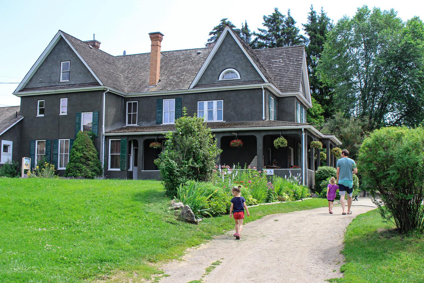 family walking up to heritage house