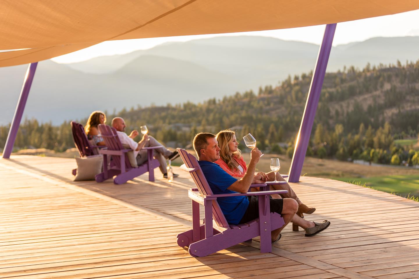 people sitting having wine looking at view