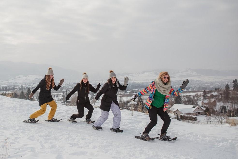 women snowshoeing