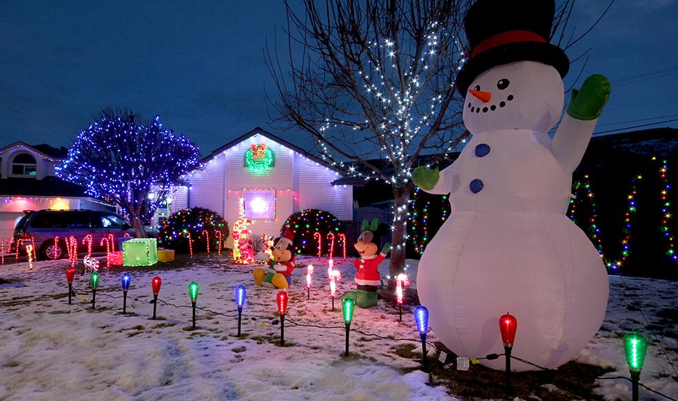 Christmas light display with blowup snowman