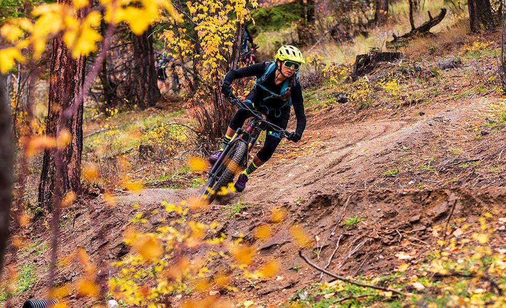 mountain biker going down trail