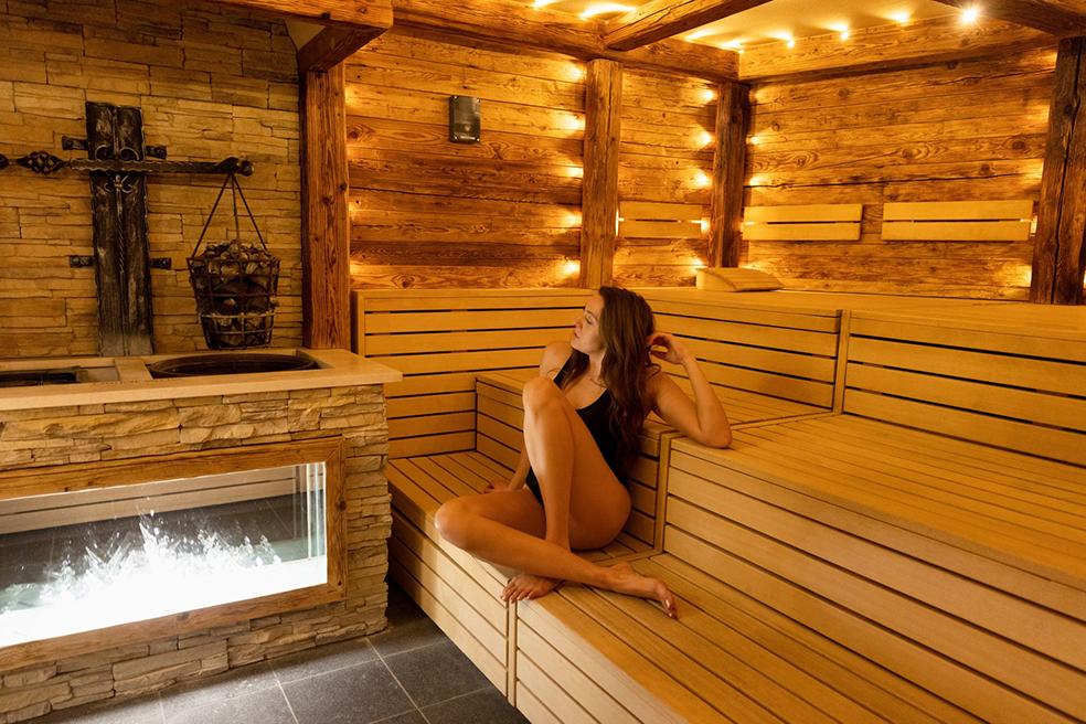 woman sitting in sauna