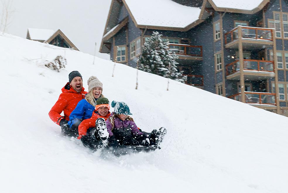family tobogganing