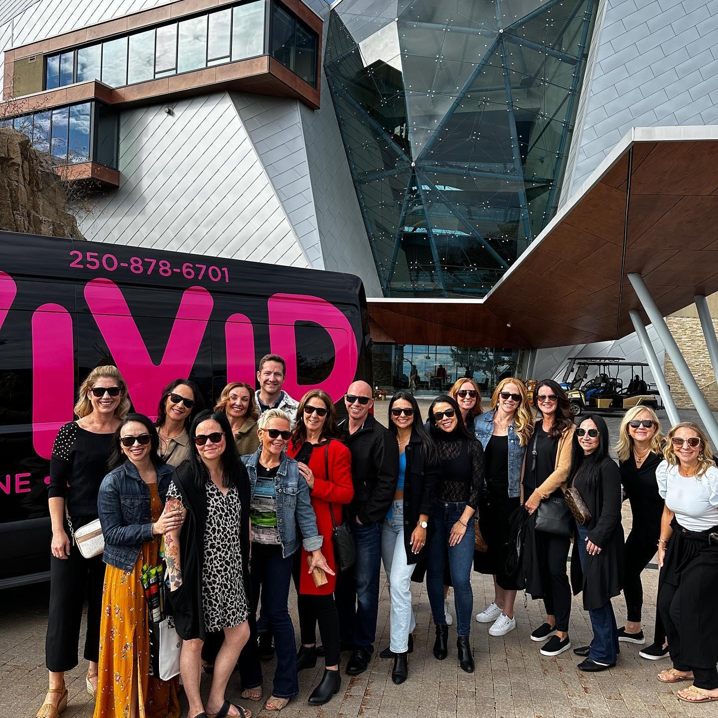 group standing in front of wine tour van