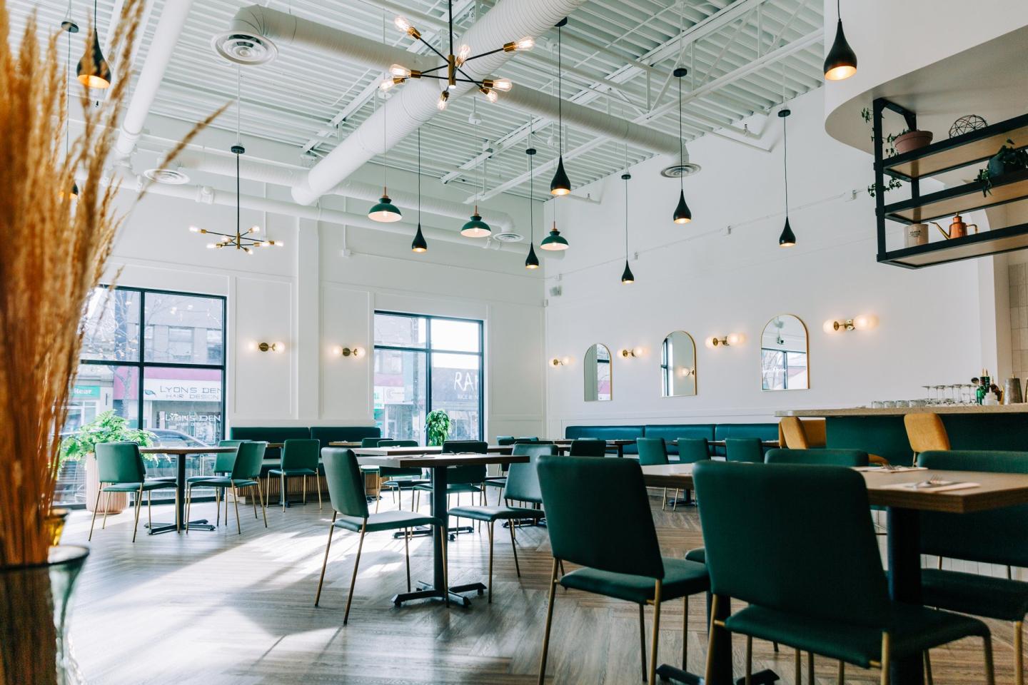 Table and chairs set up for guests in Maserio Pizzeria