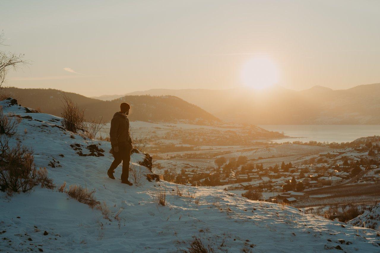 winter hiking on ridge at sunset
