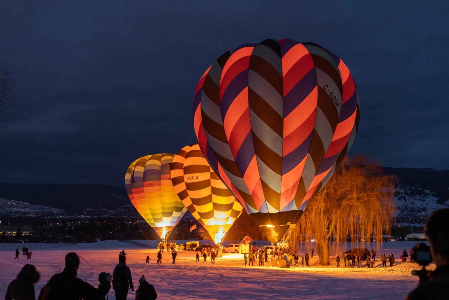 Hot air balloons light up at night in Polson Park Vernon BC