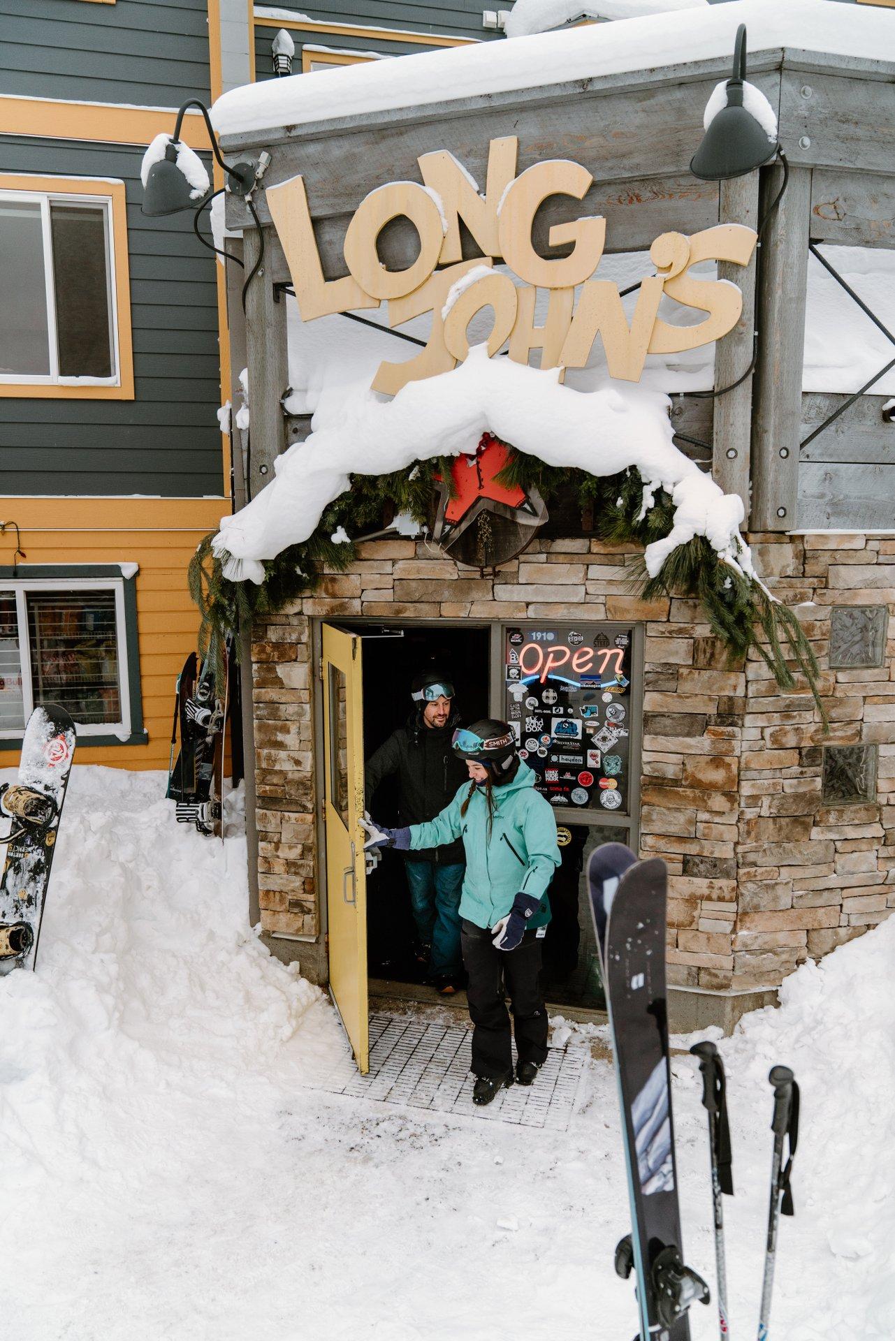 Couple leaving Long John's Pub at Silver Star Mountain Resort