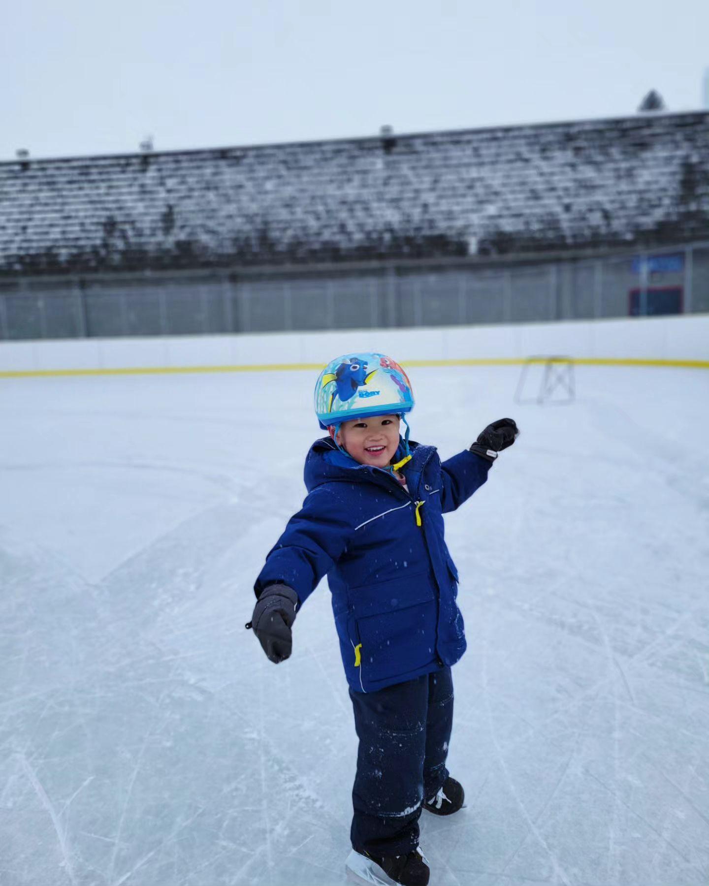 Boy skating on outdoor rink