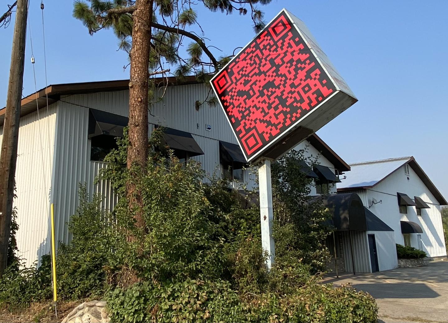 Exterior photo of Cardiff Miller Art Warehouse with QR code sign