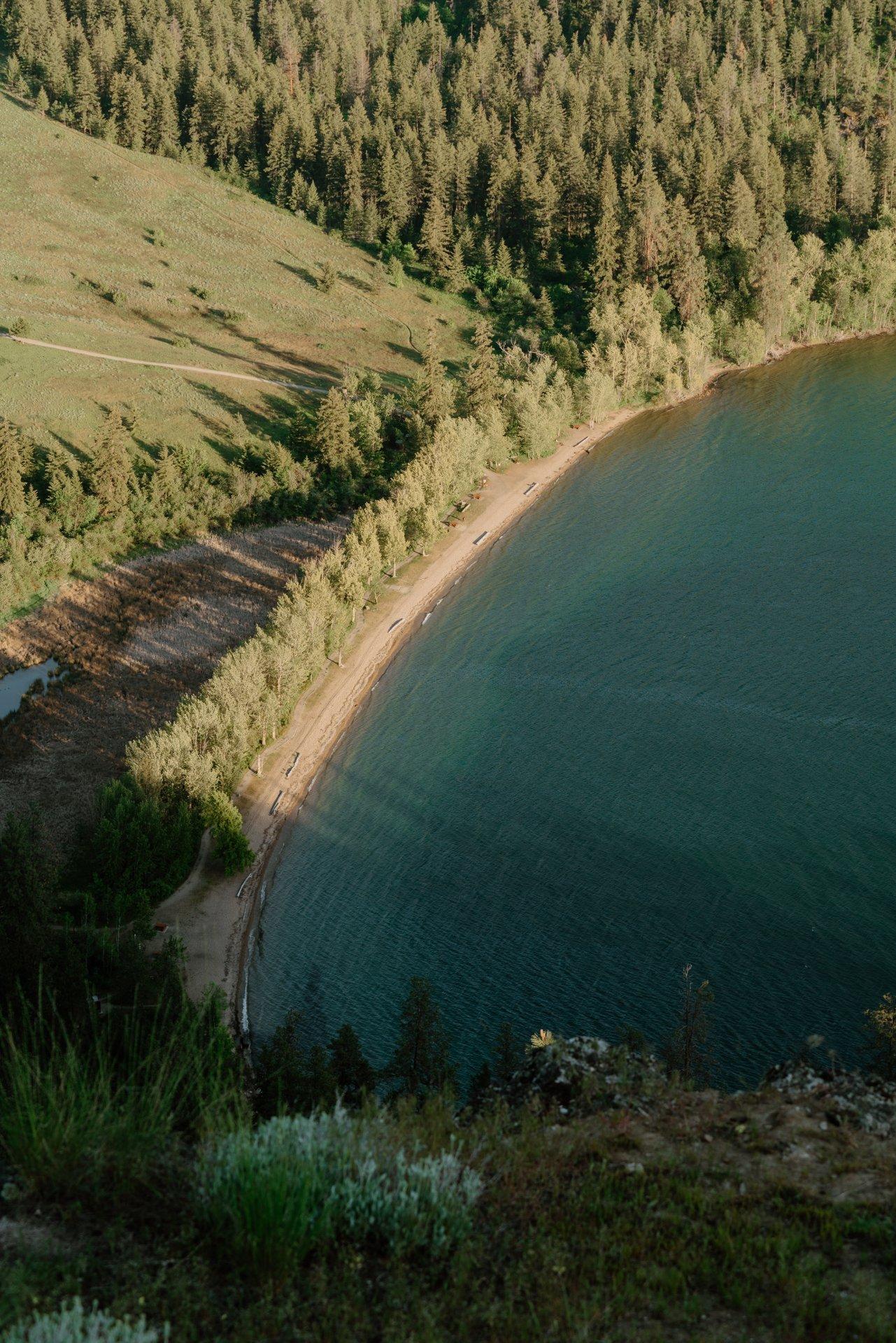 Ariel shot of Cosens Bay Beach featuring sandy shoes and turquoise waters