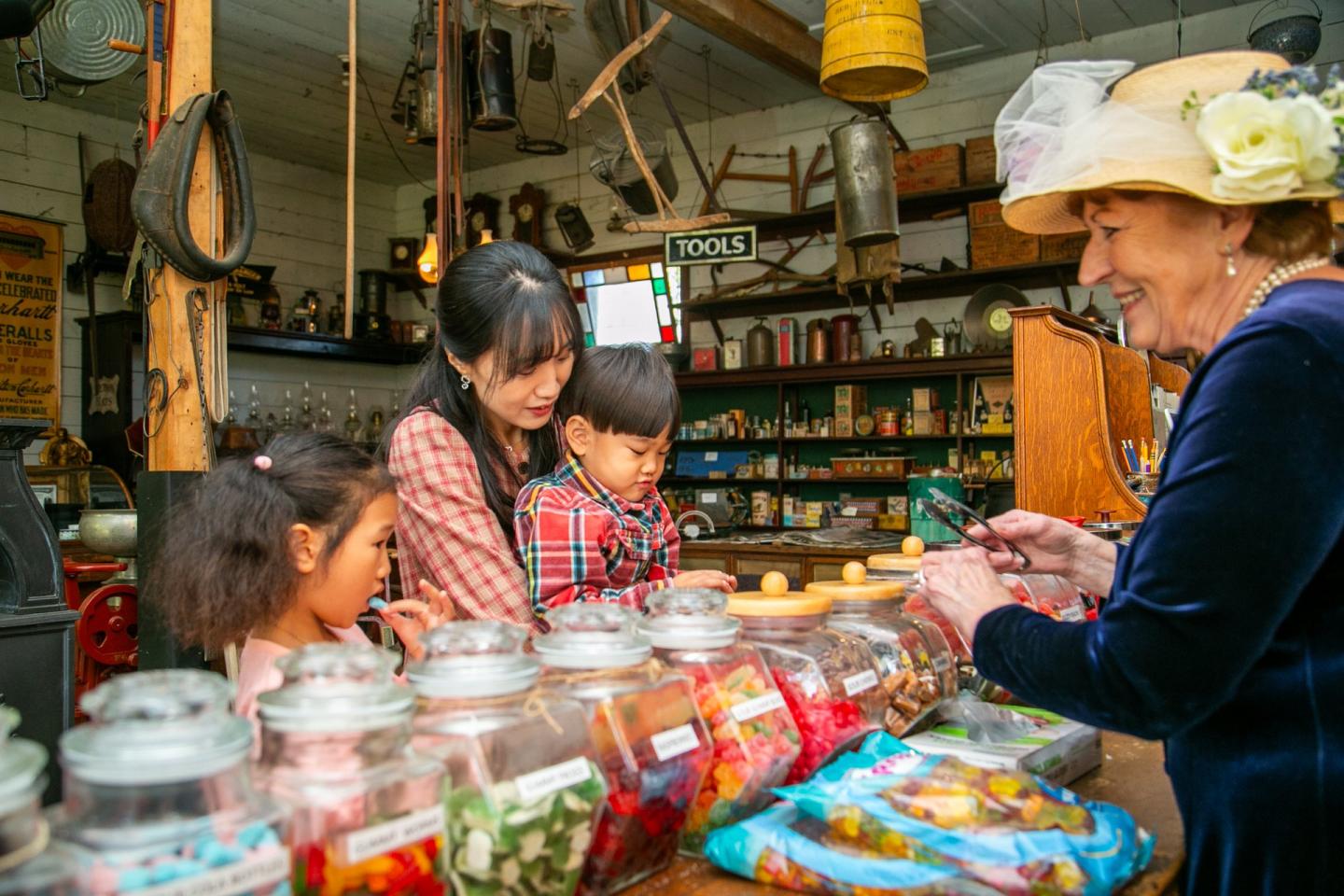 Family shopping the candy store at O'Keefe Ranch