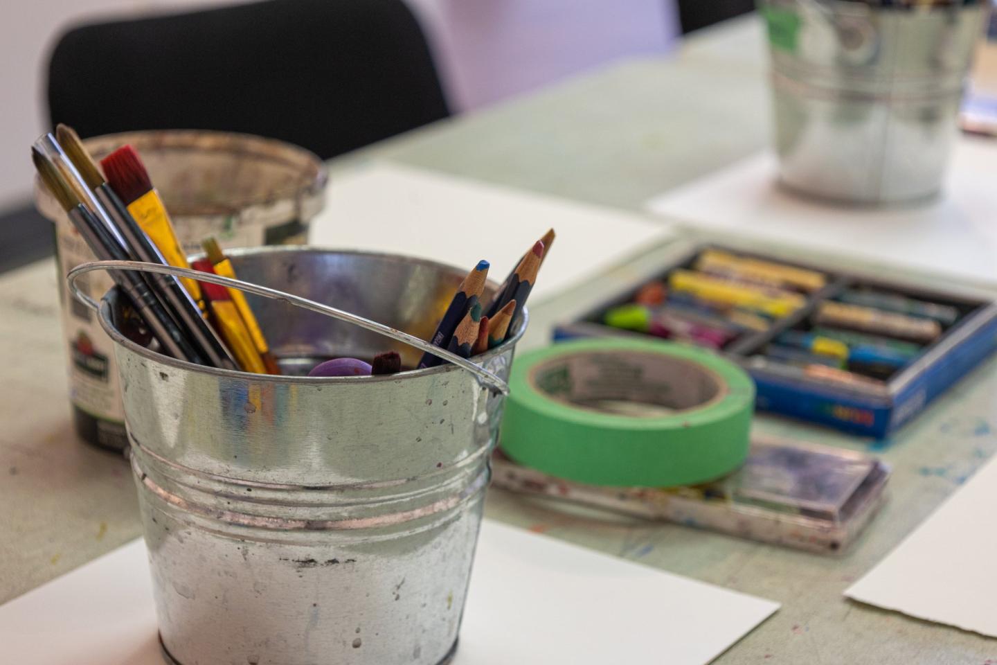 Art supplies sitting on a desk