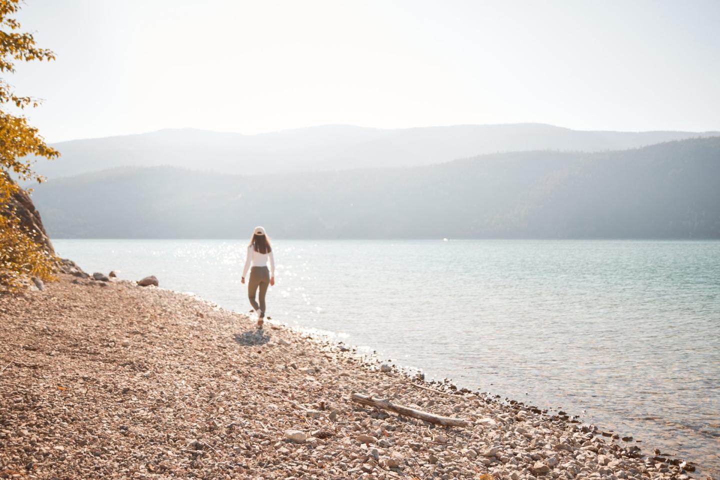 Woman walking along the shores at Kekuli