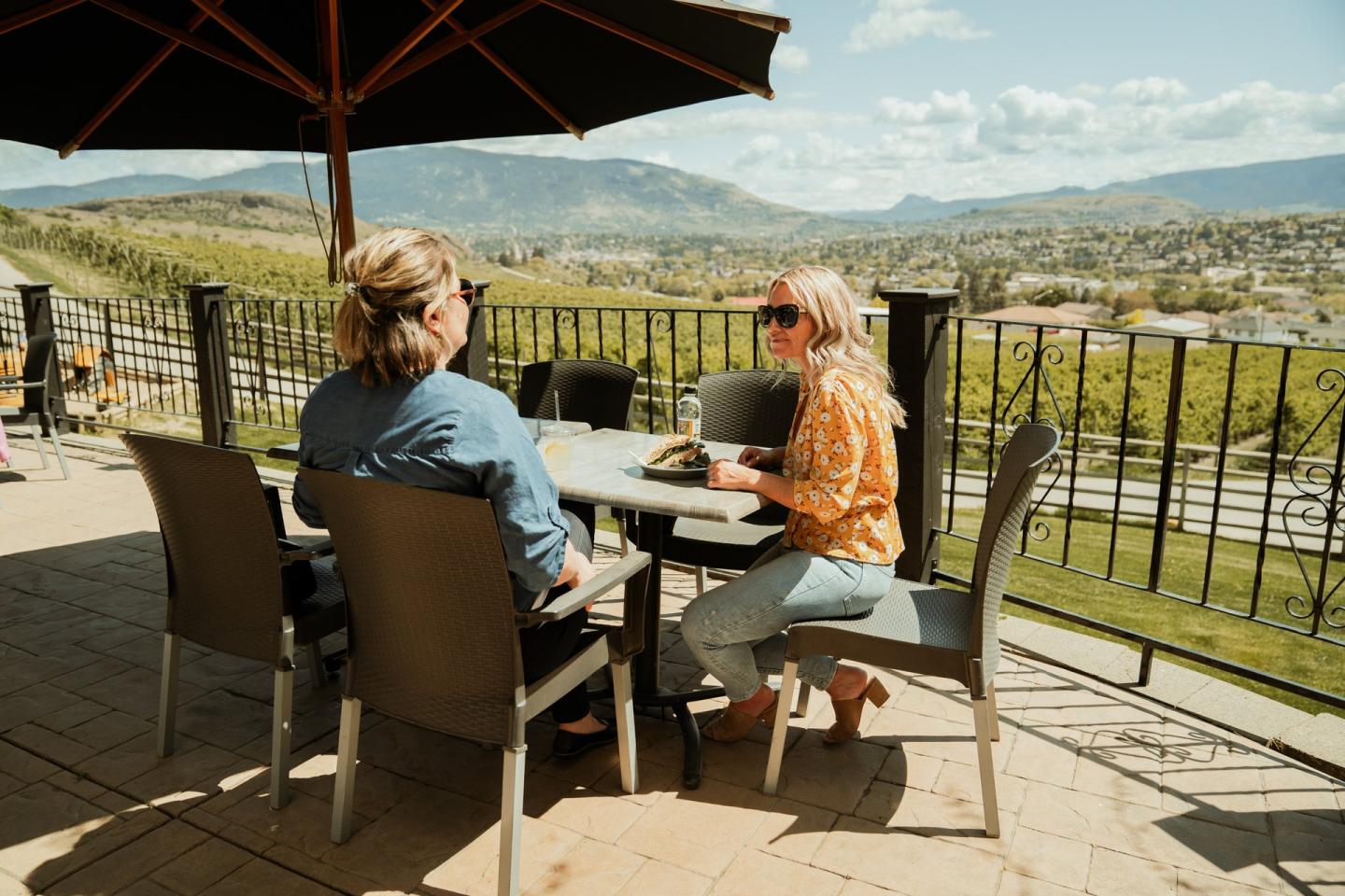 Two women sitting on the patio at Davison Orchards