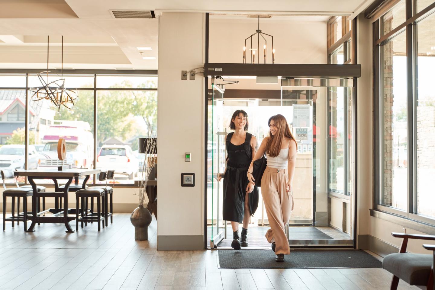 couple walking into hotel lobby