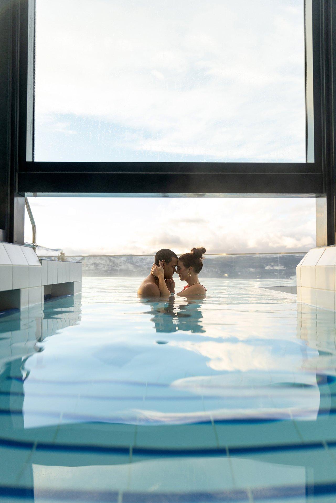 couple enjoying an infinity pool at Sparkling Hill Resort