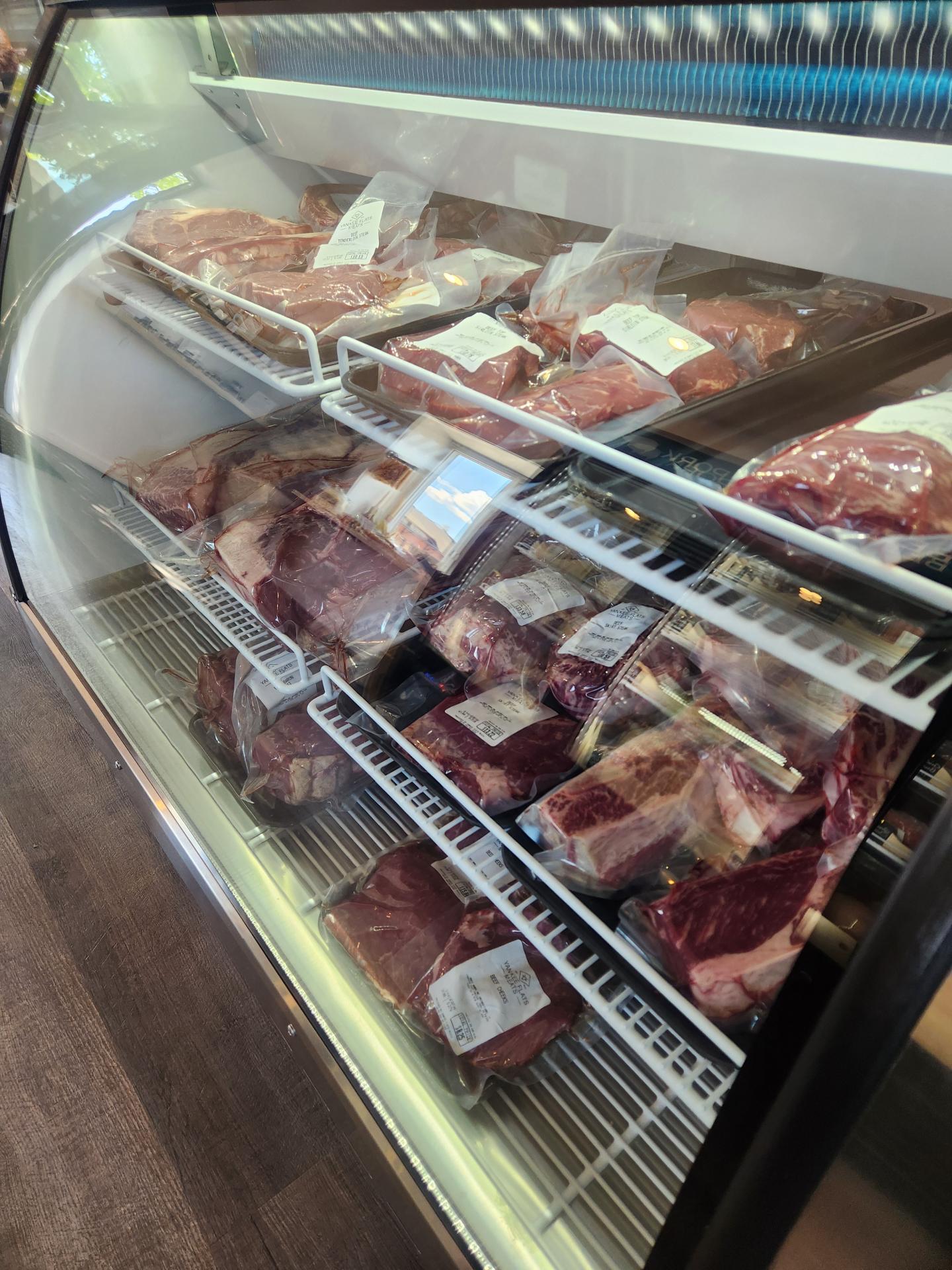 fresh meat display case in grocery store