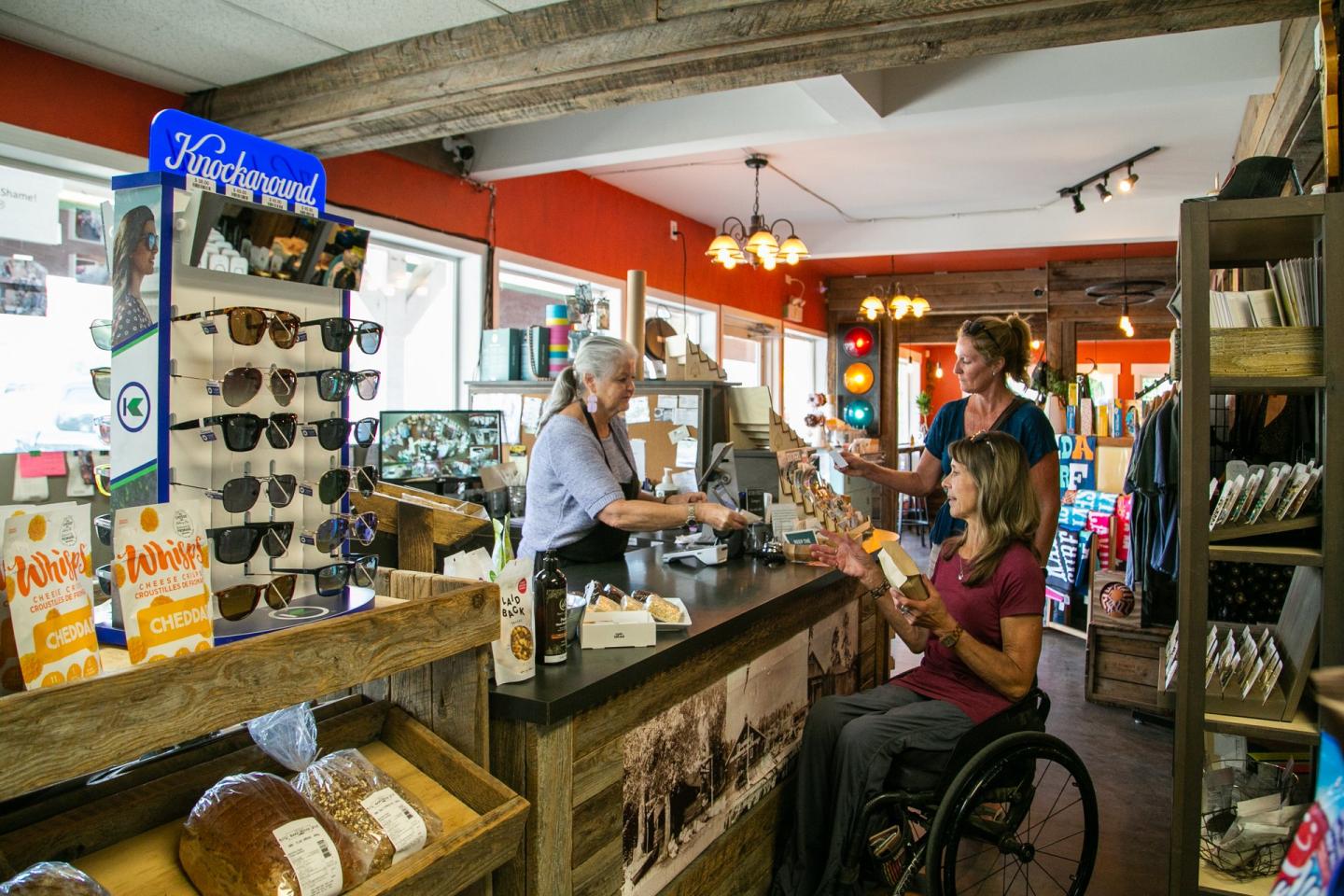 friends purchasing retail items at front desk of store