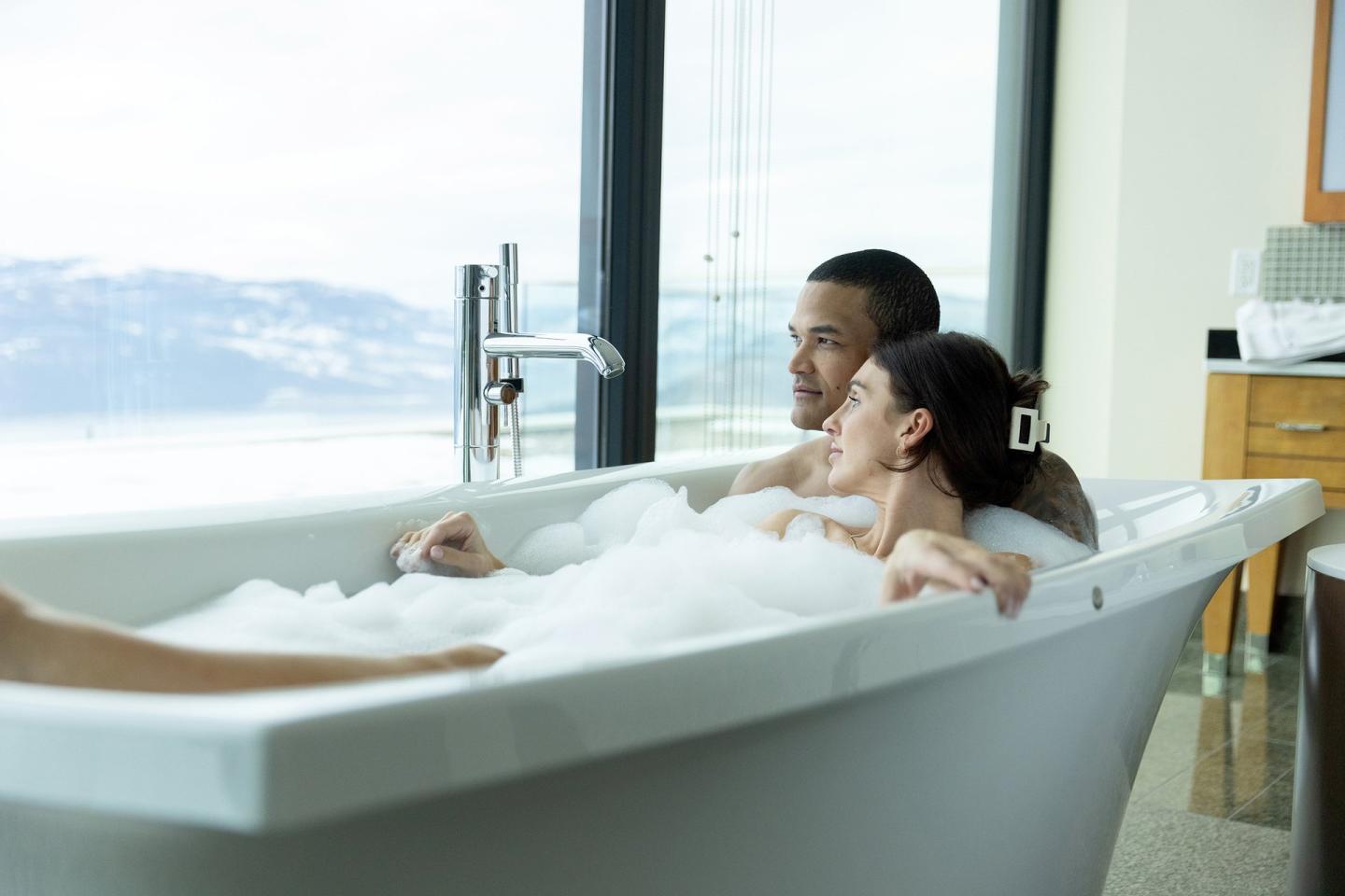 couple in bathtub at luxury european-inspired resort