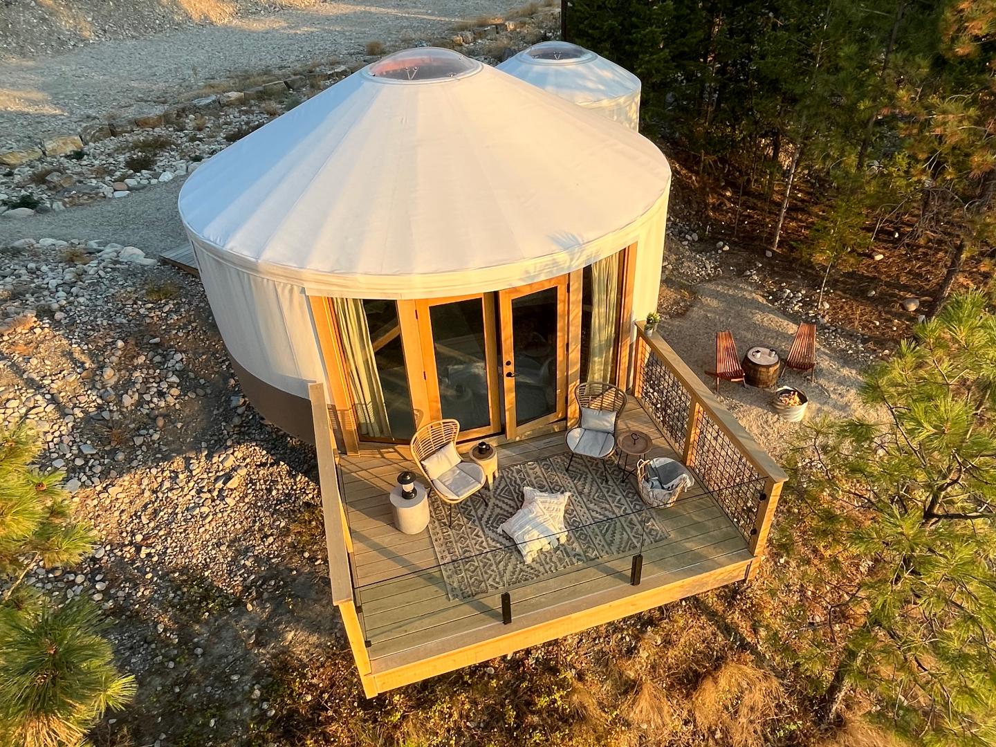 glamping yurt aerial view with golden sunlight
