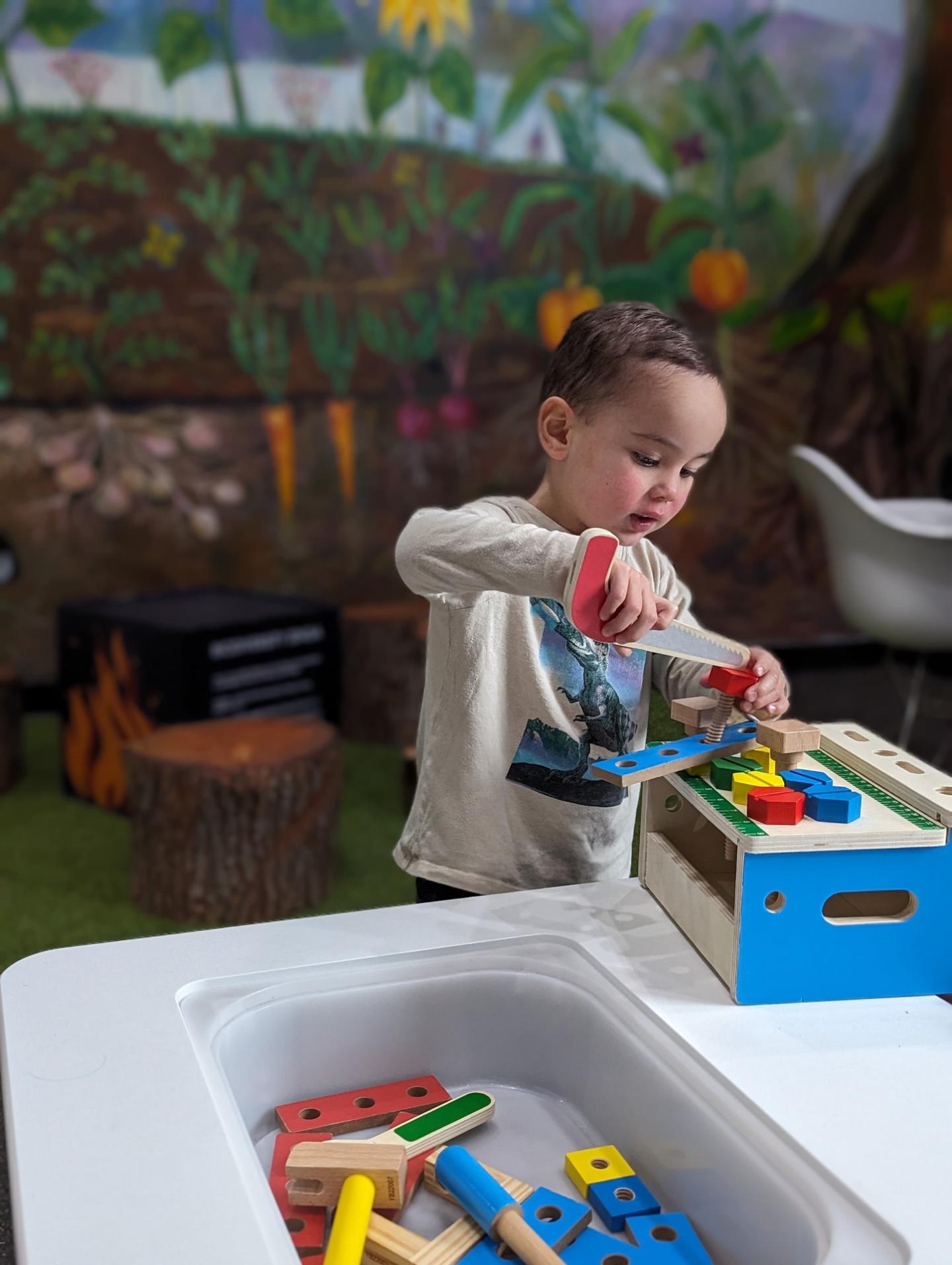 child playing with building blocks at a science centre