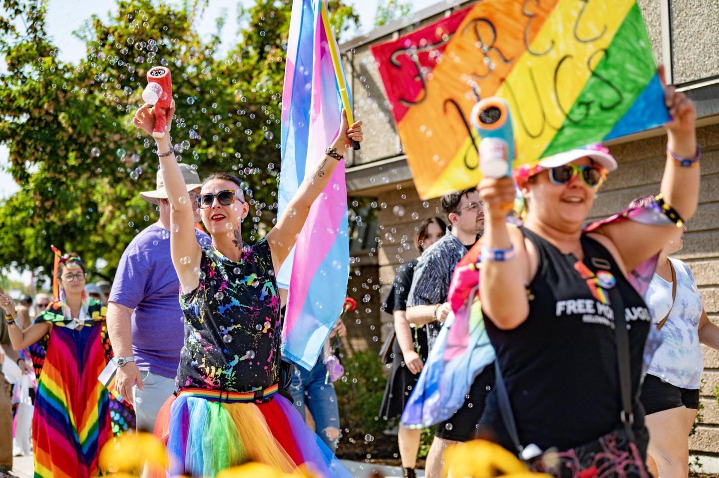 people dressed up for a pride week parade