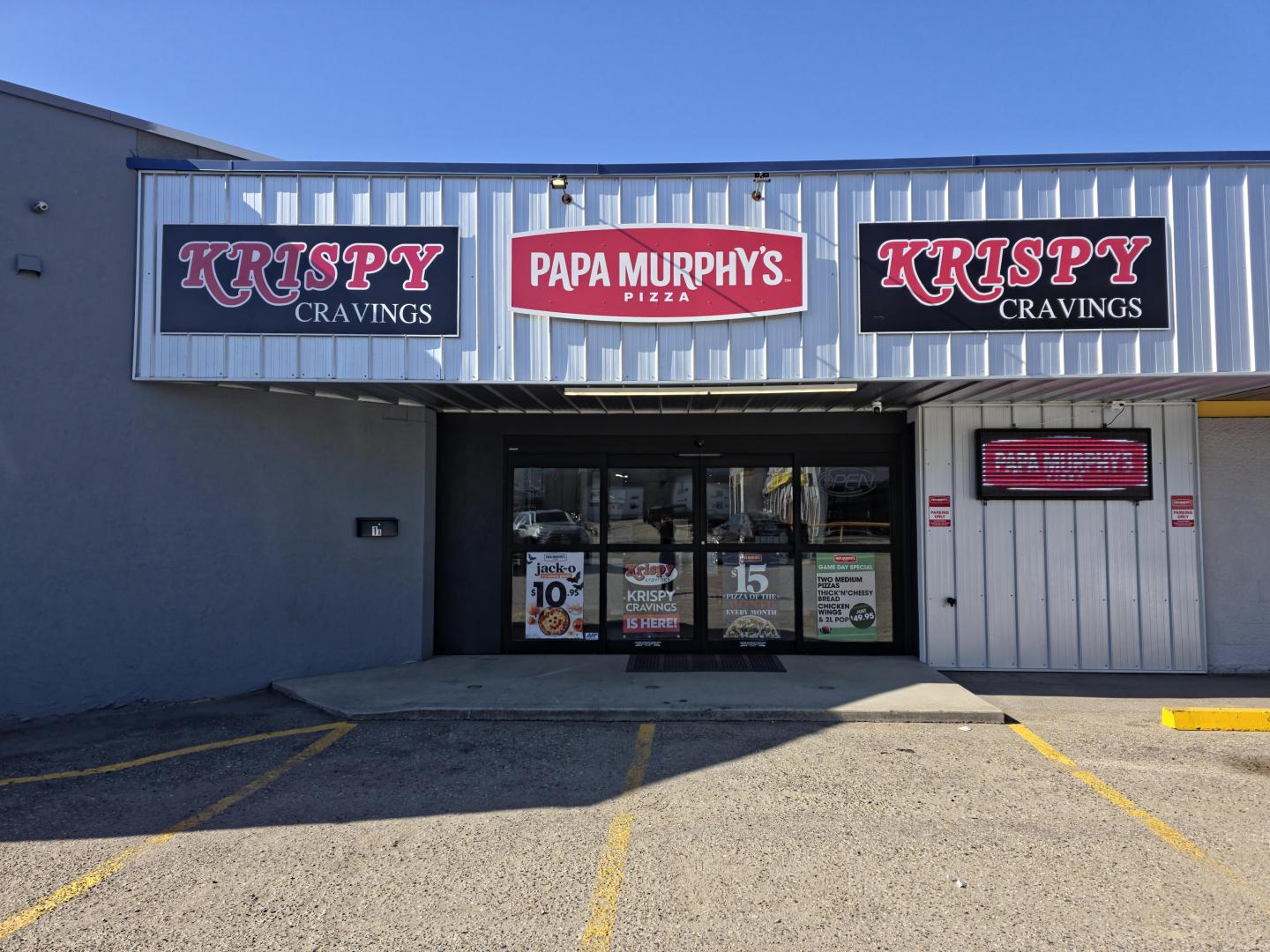 Papa Murphy's storefront with parking lot on a sunny day.